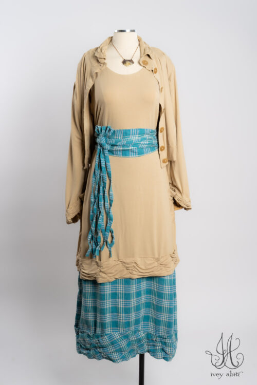 Bertie Jacket in Oyster Soft and Stretchy Knit; Tollie Top in Oyster Soft and Stretchy Knit; Porte Cochere Sash in Turquoise Woven Plaid; Fitzgerald Skirt in Turquoise Woven Plaid; Heirloom Necklace.
