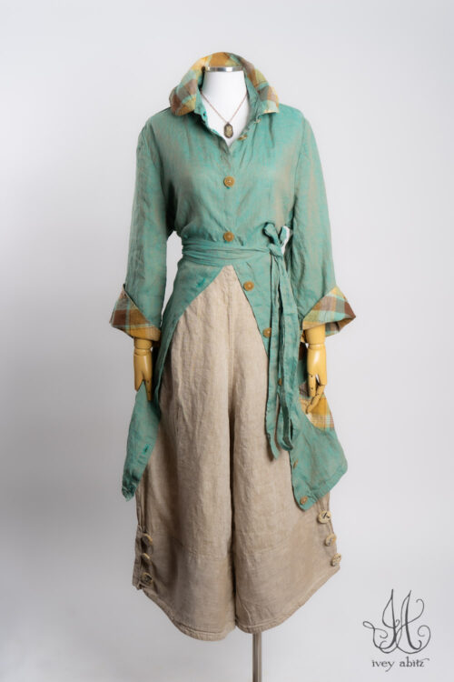 Rosemarie Duster Coat in Sea Foam Washed Weave with Plaid Detail; Viv Trousers in Oyster Washed Weave; Heirloom Necklace.
