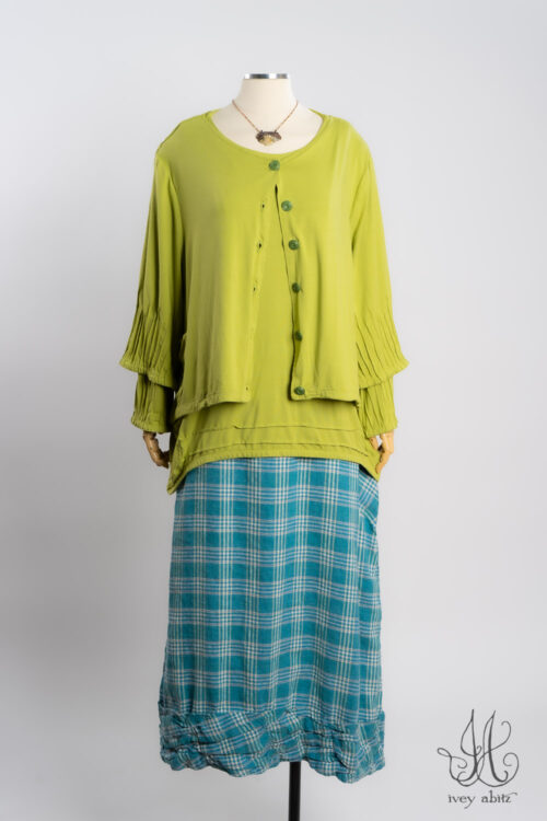 Lydia Jacket in Avocado Soft and Stretchy Knit; Lydia Shirt in Avocado Soft and Stretchy Knit; Fitzgerald Skirt in Turquoise Woven Plaid; Heirloom Necklace.