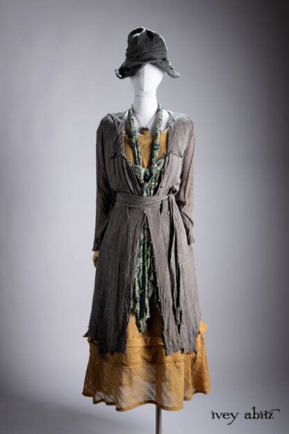 Vanetten Duster Coat in River Fog Ethereal Soft Voile; Ettienne Sash in Valley Sky Floral Silk Chiffon; Hudson Frock in Autumn Leaf Embroidered Stripe Voile; Cilla Slip Frock in Bark Silky Knit; Hapgood Hat in River Fog Cashmere Hat Weave; Heirloom Necklace.