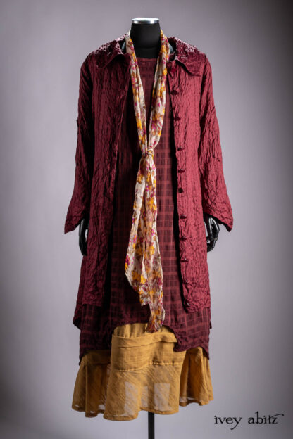 Chittister Duster Coat in Crimson Sky Washed Stripe Silk; Chittister Frock in Plaid Sateen and Chiffon; Blanchefleur Sash in Autumn Leaf Floral Silk Chiffon; Hudson Frock in Autumn Leaf Embroidered Stripe Voile; Cilla Slip Frock in Bark Silky Knit.