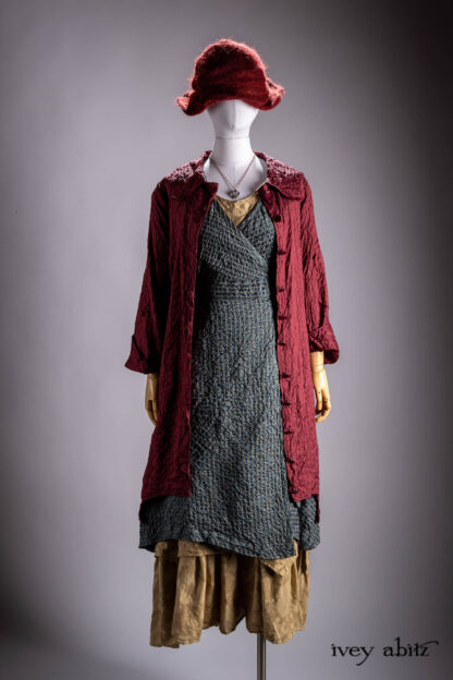 Chittister Duster Coat in Crimson Sky Washed Stripe Silk; Chomley Frock in Valley Sky and Natural Embroidered Stripe Washed Silk; Liberte Frock in Riverbank Floral Woven Weave; Crimson Sky Mohair Hat and Scarf Knit; Nouvelle Necklace.
