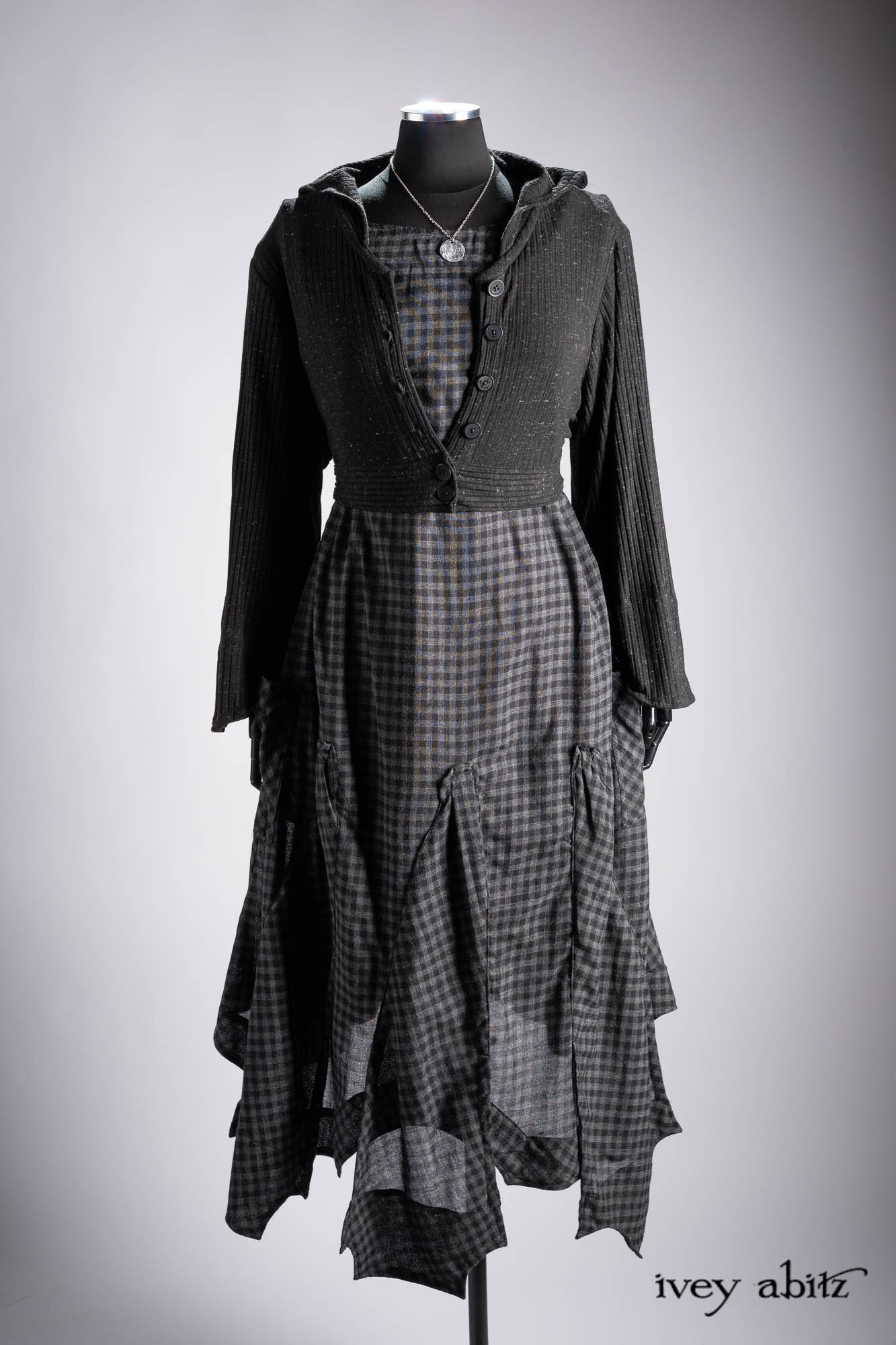 Ellis Duster Coat in Idyllic Green Woven Weave; Pierrepont Shirt in Crimson Three-Leaf Silk; Liberte Frock in Riverbank Floral Woven Weave; Cilla Slip Frock in Bark Silky Knit; Hapgood Hat in Bark Washed Woven Hat Weave; Nouvelle Necklace.