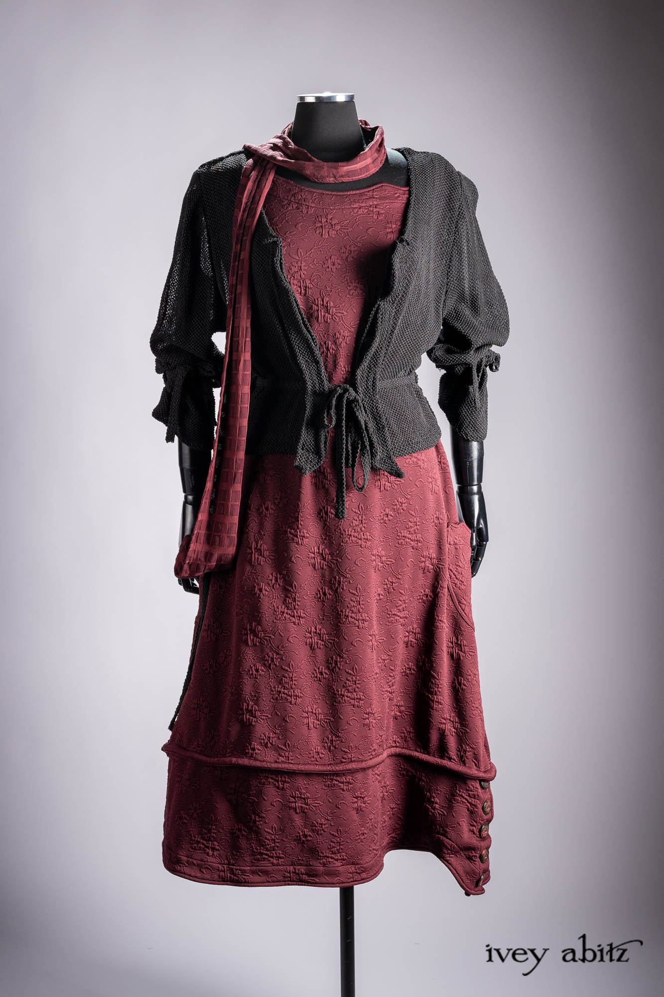 Ellis Duster Coat in Idyllic Green Woven Weave; Pierrepont Shirt in Crimson Three-Leaf Silk; Liberte Frock in Riverbank Floral Woven Weave; Cilla Slip Frock in Bark Silky Knit; Hapgood Hat in Bark Washed Woven Hat Weave; Nouvelle Necklace.