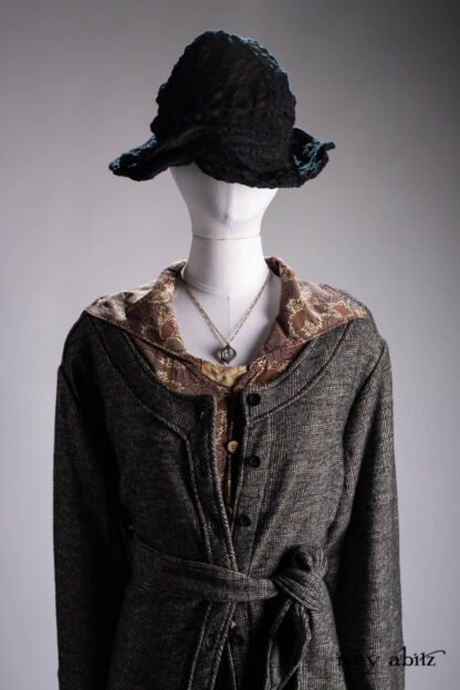 Highlands Duster Coat in Mountain and Riverbank Plaid Knit; Pierrepont Shirt in Crimson Sky Three-Leaf Silk; Liberte Frock in Riverbank Floral Woven Weave; Cilla Slip Frock in Bark Silky Knit; Hapgood Hat in Mountain Plaid Hat Weave; Nouvelle Necklace.