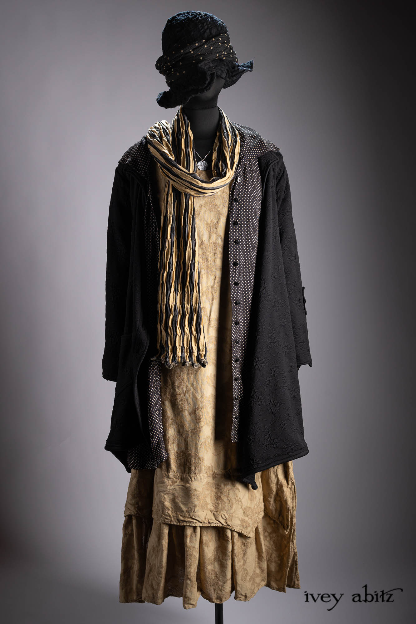 Vanetten Duster Coat in River Fog Ethereal Soft Voile; Liberte Frock in Riverbank Floral Woven Weave; Baedeker Scarf in Crimson Sky Floral Silk Velvet; Cilla Slip Frock in Bark Silky Knit; Hapgood Hat in Bark Washed Woven Hat Weave; Heirloom Necklace.