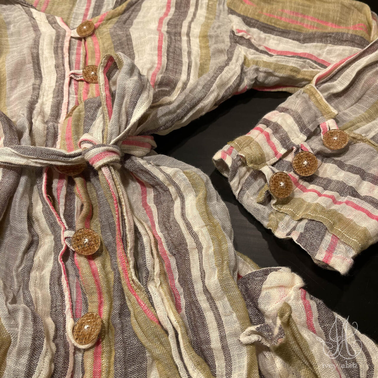 Incredible combination of ethereal voile, pressed buttons, and one killer shirt design.