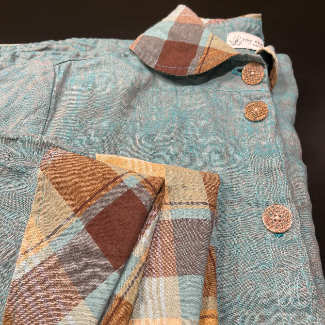 Limited Edition Rosemarie getting folded carefully and placed into an Ivey Abitz presentation box before sending to its person.
