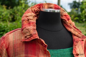 Gabled Duster Coat in Sunnyside Washed Plaid; Campanella Frock in Gracious Green Washed Crinkled Linen; Idyll Brooch in Rose Garden Silk Weaves. Ivey Abitz at Boscobel House and Gardens