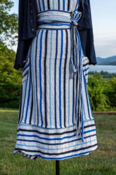 Harrison Frock in Hudson Blue Embroidered Stripe Voile; Porte Cochere Sash in Hudson Blue Embroidered Stripe Voile; Cilla Slip Frock in Peony Soft Ribbed Knit; Crest Jacket in Hudson Blue Soft Ribbed Knit; Soutache Brooch in Black Weaves. Ivey Abitz at Boscobel House and Gardens