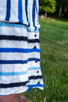 Harrison Frock in Hudson Blue Embroidered Stripe Voile; Porte Cochere Sash in Hudson Blue Embroidered Stripe Voile; Cilla Slip Frock in Peony Soft Ribbed Knit; Crest Jacket in Hudson Blue Soft Ribbed Knit; Soutache Brooch in Black Weaves. Ivey Abitz at Boscobel House and Gardens