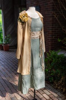 Porte Cochere Shirt Jacket in Yellow Days Washed Stripe Cotton; Porte Cochere Sash in Watercolour Silk Weave; Idyll Brooch in Yellow Days Weaves; Hudson Frock in Herb Garden Washed Linen. Ivey Abitz at Boscobel House and Gardens