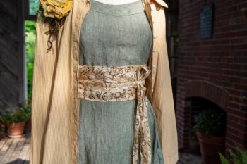 Porte Cochere Shirt Jacket in Yellow Days Washed Stripe Cotton; Porte Cochere Sash in Watercolour Silk Weave; Idyll Brooch in Yellow Days Weaves; Hudson Frock in Herb Garden Washed Linen. Ivey Abitz at Boscobel House and Gardens
