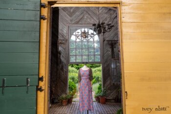 Covante Frock in Rose Garden Patch Plaid Voile; Fairholme Sash in Rose Garden Plaid Patch Voile; Chevallier Cardigan in Herb Garden Soft Ribbed Knit. Ivey Abitz at Boscobel House and Gardens