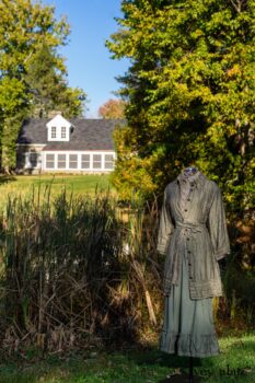 Gabled Duster Coat in Peace and Civility Stripe Linen; Gabled Shirt Jacket in Civility Washed Linen; Gabled Trousers in Civility Washed Stretch Weave; Clotaire Sash in Civility Garden Row Silk Chiffon. Location: Near the bridge and entrance to Stone Cottage and Val-Kill Cottage, the home of Eleanor Roosevelt. Eleanor Roosevelt National Historic Site, Hyde Park, New York.