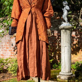 Truitt Shirt Jacket in Independence Embroidered Washed Silk; Eleanora Frock in Independence Washed Linen. Location: Inside the walled garden at the Eleanor Roosevelt National Historic Site. Val-Kill Cottage, Hyde Park, New York.