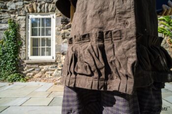 Hudson Duster Coat in Peace Soft Pinstripe Cotton; Hudson Frock in Civility Soft Check Twill; Porte Cochere Sash in Civility Floral Stretch Weave. Location: East profile of Stone Cottage. Eleanor Roosevelt National Historic Site. Val-Kill, Hyde Park, New York.