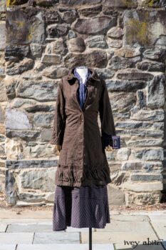 Hudson Duster Coat in Peace Soft Pinstripe Cotton; Hudson Frock in Civility Soft Check Twill; Porte Cochere Sash in Civility Floral Stretch Weave. Location: East profile of Stone Cottage. Eleanor Roosevelt National Historic Site. Val-Kill, Hyde Park, New York.