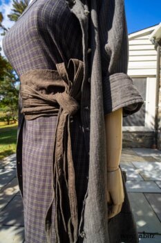 Gabled Duster Coat in Peace and Civility Stripe Linen; Gabled Shirt Jacket in Civility Washed Linen; Gabled Trousers in Civility Washed Stretch Weave. Location: Beside bridge that leads to Stone Cottage at Eleanor Roosevelt National Historic Site.