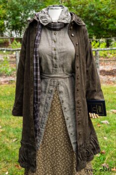 Gabled Duster Coat in Civility Floral Stretch Weave; Gabled Shirt Jacket in Civility Washed Linen; Baedeker Scarf in Dignity Soft Plaid Flannel; Gabled Skirt in Dignity Floral Cotton Twill. Location: Eleanor's garden and west profile of Stone Cottage. Eleanor Roosevelt National Historic Site. Val-Kill, Hyde Park, New York.