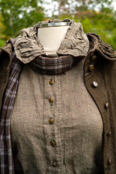 Gabled Duster Coat in Civility Floral Stretch Weave; Gabled Shirt Jacket in Civility Washed Linen; Baedeker Scarf in Dignity Soft Plaid Flannel; Gabled Skirt in Dignity Floral Cotton Twill. Location: Eleanor's garden and west profile of Stone Cottage. Eleanor Roosevelt National Historic Site. Val-Kill, Hyde Park, New York.