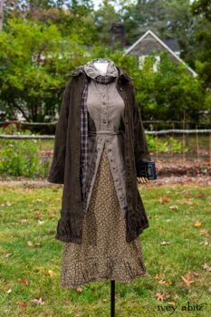 Gabled Duster Coat in Civility Floral Stretch Weave; Gabled Shirt Jacket in Civility Washed Linen; Baedeker Scarf in Dignity Soft Plaid Flannel; Gabled Skirt in Dignity Floral Cotton Twill. Location: Eleanor's garden and west profile of Stone Cottage. Eleanor Roosevelt National Historic Site. Val-Kill, Hyde Park, New York.