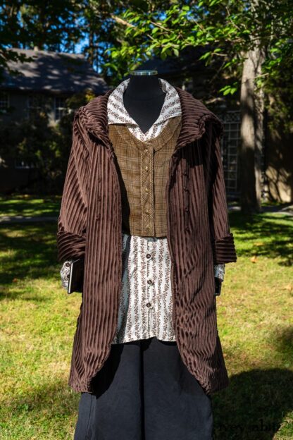 Eleanora Duster Coat in Dignity Soft Wale Cord; Highlands Vest in Dignity Cotton Plaid Velvet; Pierrepont Shirt in Dignity Washed Vine Silk; Vanetten Trousers in Unity Washed Cord. Location: Center of grounds between main house (that was a former furniture factory) and Stone Cottage. Hyde Park, New York.Val-Kill,