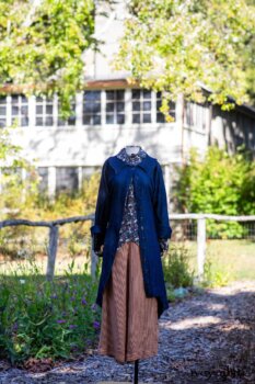 Chittister Duster Coat in Liberty Pin Tuck Twill; Truitt Shirt in Independence Floral and Vine Weave; Montague Trousers in Independence Stripe Cotton. Location: Inside the front garden at the Eleanor Roosevelt National Historic Site. Val-Kill, Hyde Park, New York.
