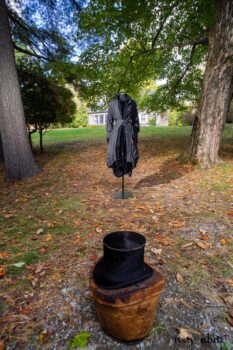 Scattergood Duster Coat in Unity Washed Linen; Scattergood Shirt Jacket in Unity Velvet Vine on Silk Chiffon; Scattergood Frock in Unity Floral Silk Velvet. Location: View of Stone Cottage from bridge at the Eleanor Roosevelt National Historic Site.