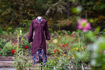 Arthur Hill Duster Coat in Honour Floral Stretch Weave; Arthur Hill Shirt in Liberty Soft Ribbed Knit; Fitz Frock in Independence Cottage Garden Weave; Blanchefleur Sash in Independence Cottage Garden Weave. Location: Inside Eleanor's flower garden. Our Independence Cottage Garden Weave was inspired by it. Eleanor Roosevelt National Historic Site. Val-Kill, Hyde Park, New York.