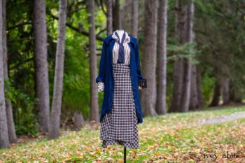 Chittister Duster Coat in Liberty Pin Tuck Twill; Pierrepont Shirt in Dignity Washed Vine Silk; Fairholme Necktie in Liberty Washed Crinkled Weave; Fairholme Skirt in Dignity Plaid Cotton. Location: Path behind house and next to pond at the Eleanor Roosevelt National Historic Site. Val-Kill, Hyde Park, New York.