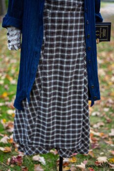 Chittister Duster Coat in Liberty Pin Tuck Twill; Pierrepont Shirt in Dignity Washed Vine Silk; Fairholme Necktie in Liberty Washed Crinkled Weave; Fairholme Skirt in Dignity Plaid Cotton. Location: Path behind house and next to pond at the Eleanor Roosevelt National Historic Site. Val-Kill, Hyde Park, New York.