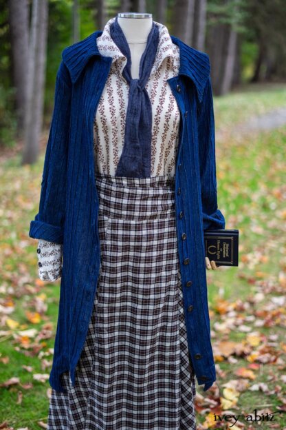 Chittister Duster Coat in Liberty Pin Tuck Twill; Pierrepont Shirt in Dignity Washed Vine Silk; Fairholme Necktie in Liberty Washed Crinkled Weave; Fairholme Skirt in Dignity Plaid Cotton. Location: Path behind house and next to pond at the Eleanor Roosevelt National Historic Site. Val-Kill, Hyde Park, New York.