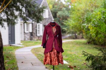 Montague Jacket in Independence Washed Cord; Blanchefleur Sash in Independence Washed Silk Chiffon; Inglenook Frock in Independence Floral Linen. Location: Path leading to loggia and Stone Cottage. Eleanor Roosevelt National Historic Site. Val-Kill, Hyde Park, New York.