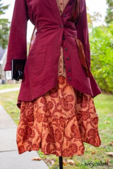 Montague Jacket in Independence Washed Cord; Blanchefleur Sash in Independence Washed Silk Chiffon; Inglenook Frock in Independence Floral Linen. Location: Path leading to loggia and Stone Cottage. Eleanor Roosevelt National Historic Site. Val-Kill, Hyde Park, New York.