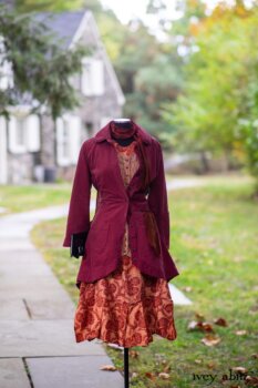 Montague Jacket in Independence Washed Cord; Blanchefleur Sash in Independence Washed Silk Chiffon; Inglenook Frock in Independence Floral Linen. Location: Path leading to loggia and Stone Cottage. Eleanor Roosevelt National Historic Site. Val-Kill, Hyde Park, New York.