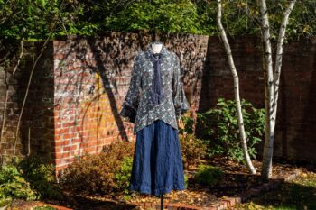 Truitt Shirt in Independence Floral and Vine Weave; Fairholme Necktie in Liberty Washed Crinkled Weave; Montague Trousers in Liberty Pin Tuck Twill. Location: Inside the walled garden at the Eleanor Roosevelt National Historic Site.