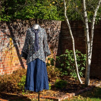 Truitt Shirt in Independence Floral and Vine Weave; Fairholme Necktie in Liberty Washed Crinkled Weave; Montague Trousers in Liberty Pin Tuck Twill. Location: Inside the walled garden at the Eleanor Roosevelt National Historic Site.