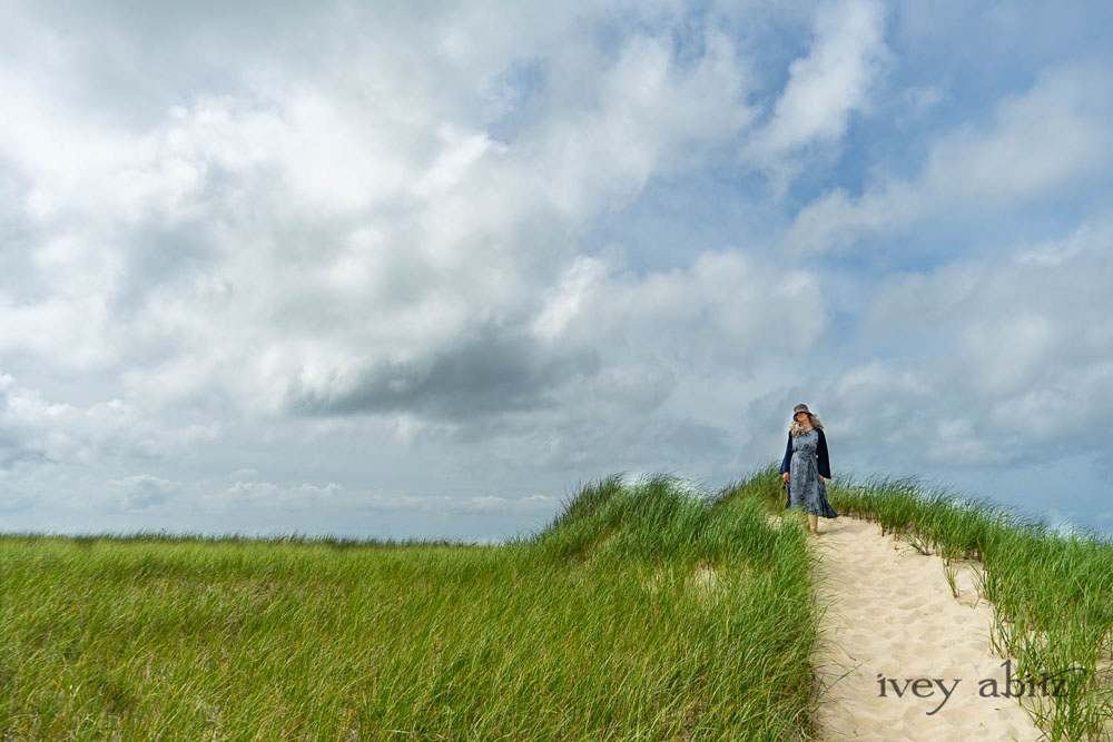 Eugenia Jacket in Seascape Melange Knit; Tilbrook Frock in Seascape Floral Linen; Porte Cochere Sash in Seascape Floral Linen. Ivey Abitz Bespoke Clothing.