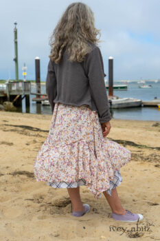 Elliot Jacket in Cape Grey Puckered Weave; Fairholme Dress in Ethereal Floral Cotton Voile; Fairholme Sash in Ethereal Floral Cotton Voile; Fairholme Frock in Plum Tree Wispy Plaid Cotton. Ivey Abitz Bespoke Clothing.