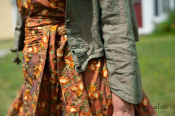 Ans Jacket in Coral and Seagrass Washed Linen; River Frock in Coral Embroidered Washed Silk; Bertie Frock in Coral and Seagrass Washed Linen; Fairholme Sash in Coral Embroidered Washed Silk. Ivey Abitz Bespoke Clothing.