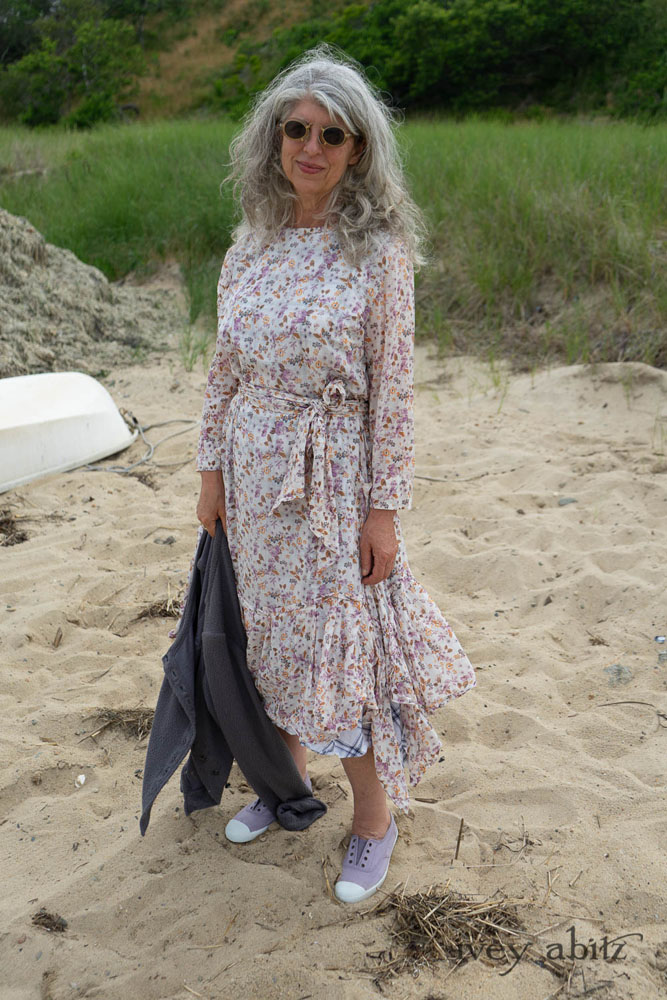 Fairholme Dress in Ethereal Floral Cotton Voile; Fairholme Sash in Ethereal Floral Cotton Voile; Fairholme Frock in Plum Tree Wispy Plaid Cotton; Elliot Jacket in Cape Grey Puckered Weave. Ivey Abitz Bespoke Clothing.