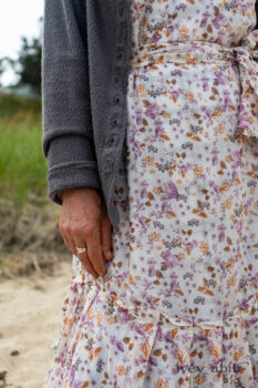 Elliot Jacket in Cape Grey Puckered Weave; Fairholme Dress in Ethereal Floral Cotton Voile; Fairholme Sash in Ethereal Floral Cotton Voile; Fairholme Frock in Plum Tree Wispy Plaid Cotton. Ivey Abitz Bespoke Clothing.