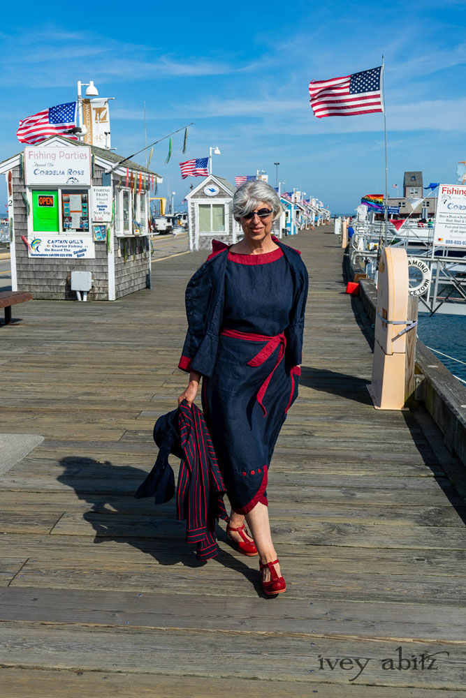 Sennen Jacket in National Seashore Washed Linen with Cape Rose Washed Linen details; Sennen Frock in National Seashore Washed Linen with Cape Rose Washed Linen detail; Limited Edition Gilbert Cardigan in National Seashore and Red Stripe Knit. Ivey Abitz Bespoke Clothing.