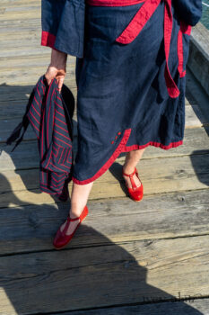 Sennen Jacket in National Seashore Washed Linen with Cape Rose Washed Linen details; Sennen Frock in National Seashore Washed Linen with Cape Rose Washed Linen detail; Limited Edition Gilbert Cardigan in National Seashore and Red Stripe Knit. Ivey Abitz Bespoke Clothing.