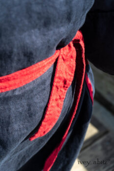 Sennen Jacket in National Seashore Washed Linen with Cape Rose Washed Linen details; Sennen Frock in National Seashore Washed Linen with Cape Rose Washed Linen detail; Limited Edition Gilbert Cardigan in National Seashore and Red Stripe Knit. Ivey Abitz Bespoke Clothing.