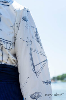 Highlands Shirt in National Seashore Sail Cotton; Clotaire Sash in National Seashore Floral Silk Chiffon; Cilla Camisole in Sailcloth Soft Ribbed Knit; Highlands Skirt in National Seashore Washed Ribbed Knit; Pierrepont Breeches-Leggings in National Seashore Washed Ribbed Knit. Ivey Abitz Bespoke Clothing.