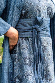 Tilbrook Duster Coat in Seascape Woven Linen; Tilbrook Frock in Seascape Floral Linen; Porte Cochere Sash in Estuary Herringbone Twill. Ivey Abitz Bespoke Clothing.