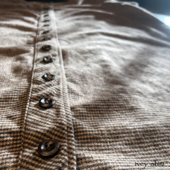 Back detail of the Montague Jacket, features our signature tab and two tie detail.