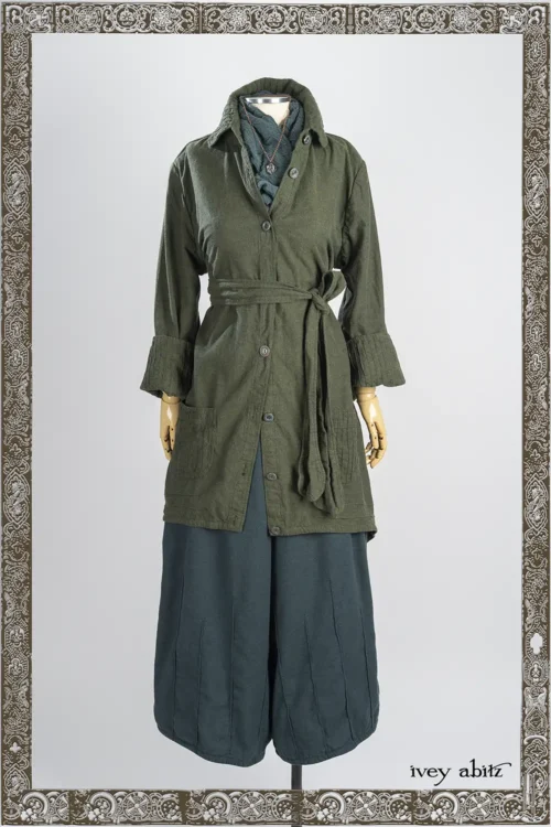 Quaint Shirt Jacket in Pine Green Brushed Weave; Lydia Neck Wrap in Hopeful Morning Crinkled Ruched Weave; Nouvelle Necklace, Mercer Trousers in Hopeful Morning Brushed Weave.
